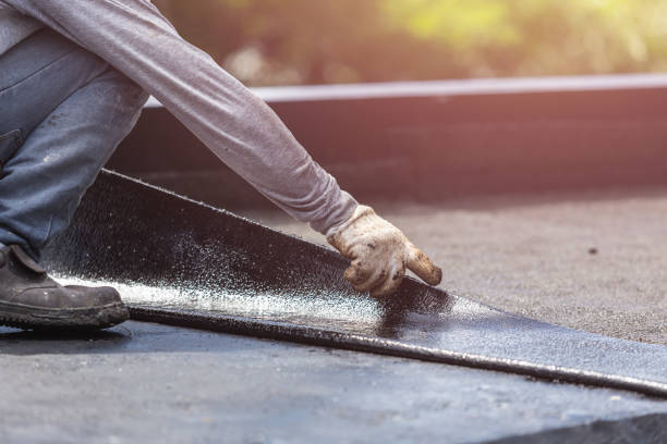 Professional Waterproofing technician working in Greenlawn, NY